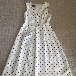 Polka dot knee length dress.